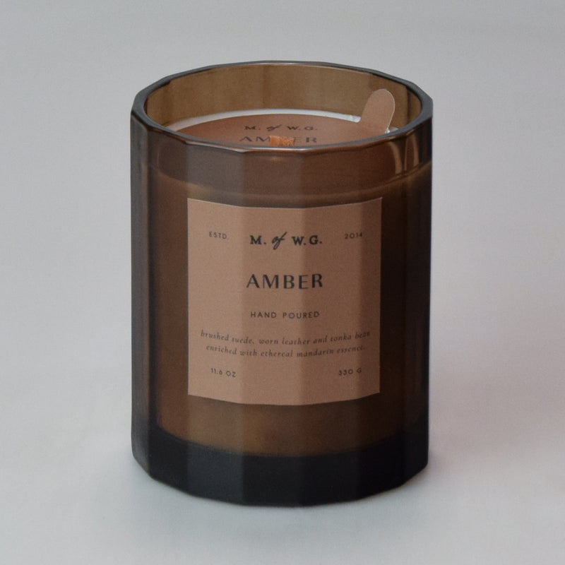 Brown candle with a label on a brown background