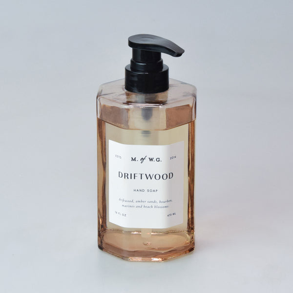 Driftwood hand soap bottle with pump on a light gray background