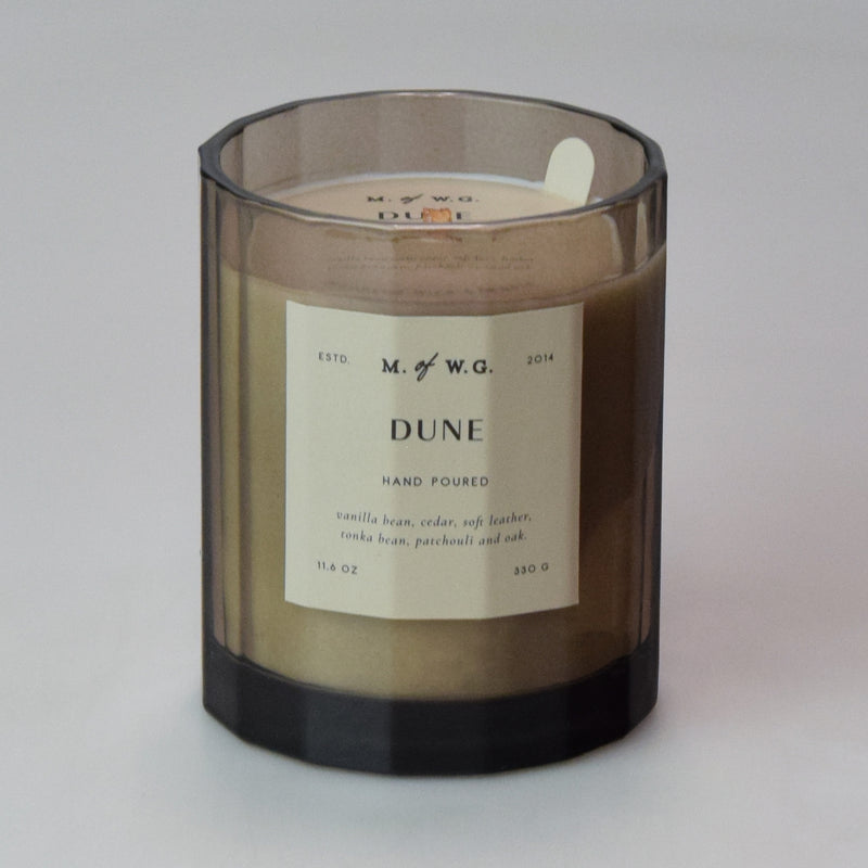 Candle with a label on a gray background