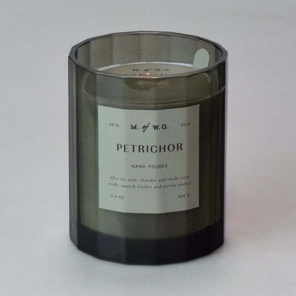 Candle with a label on a green background